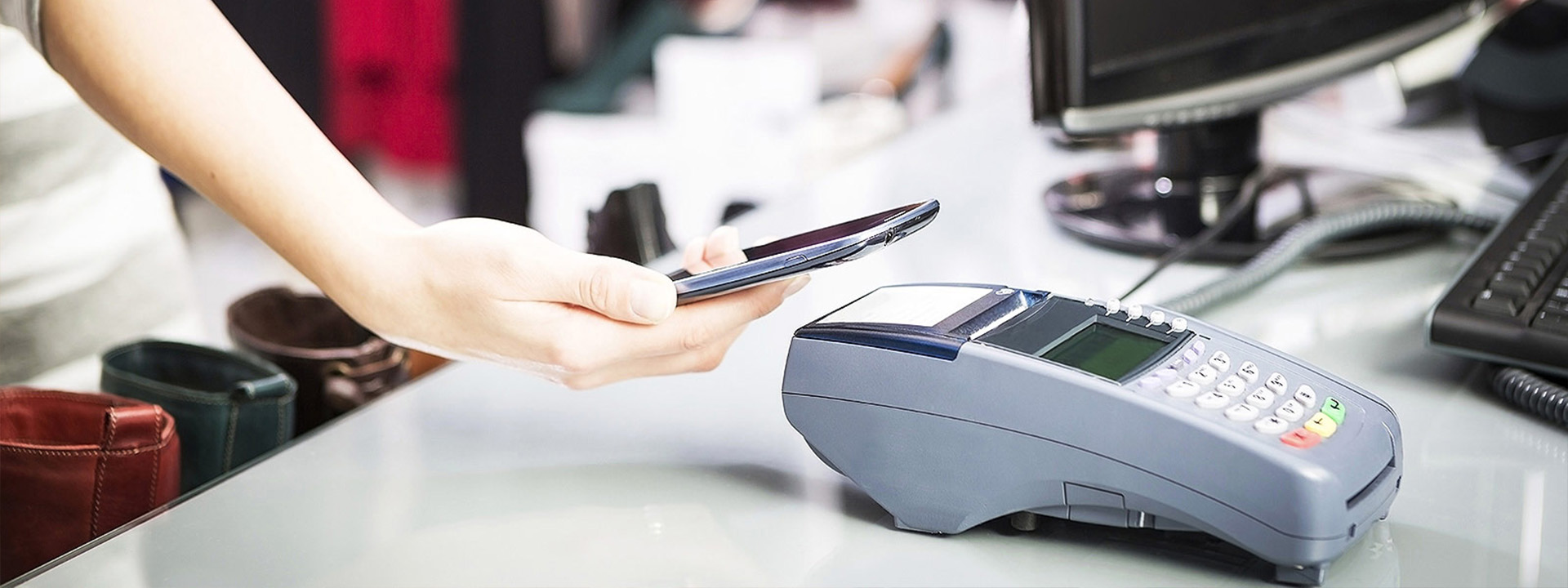 person paying with apple pay on card machine