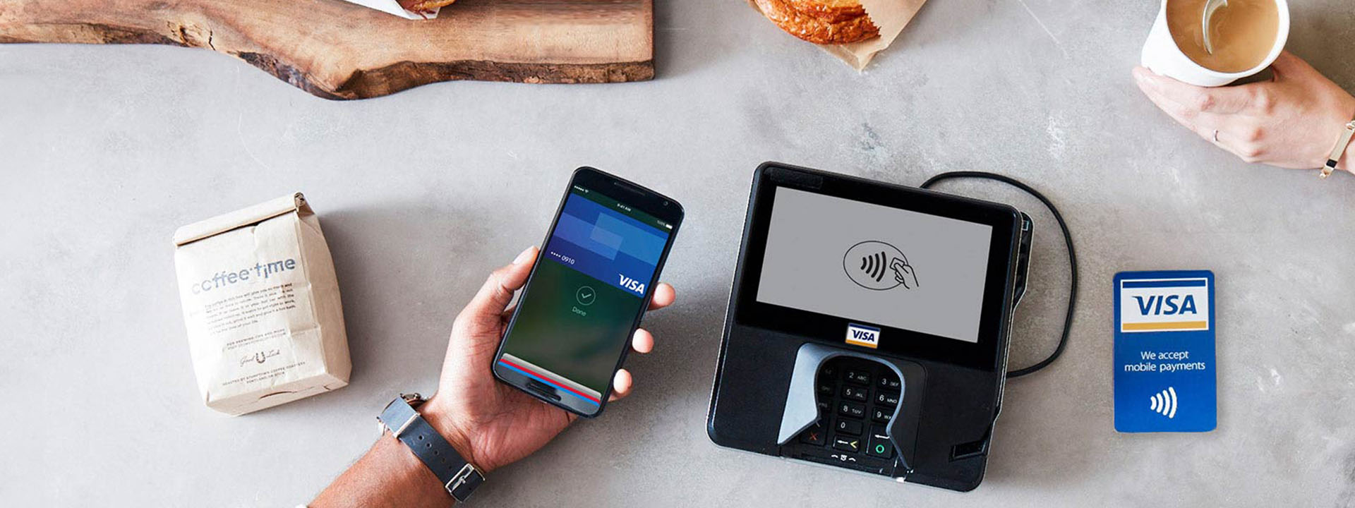 customer paying with apple pay on apple phone in cafe