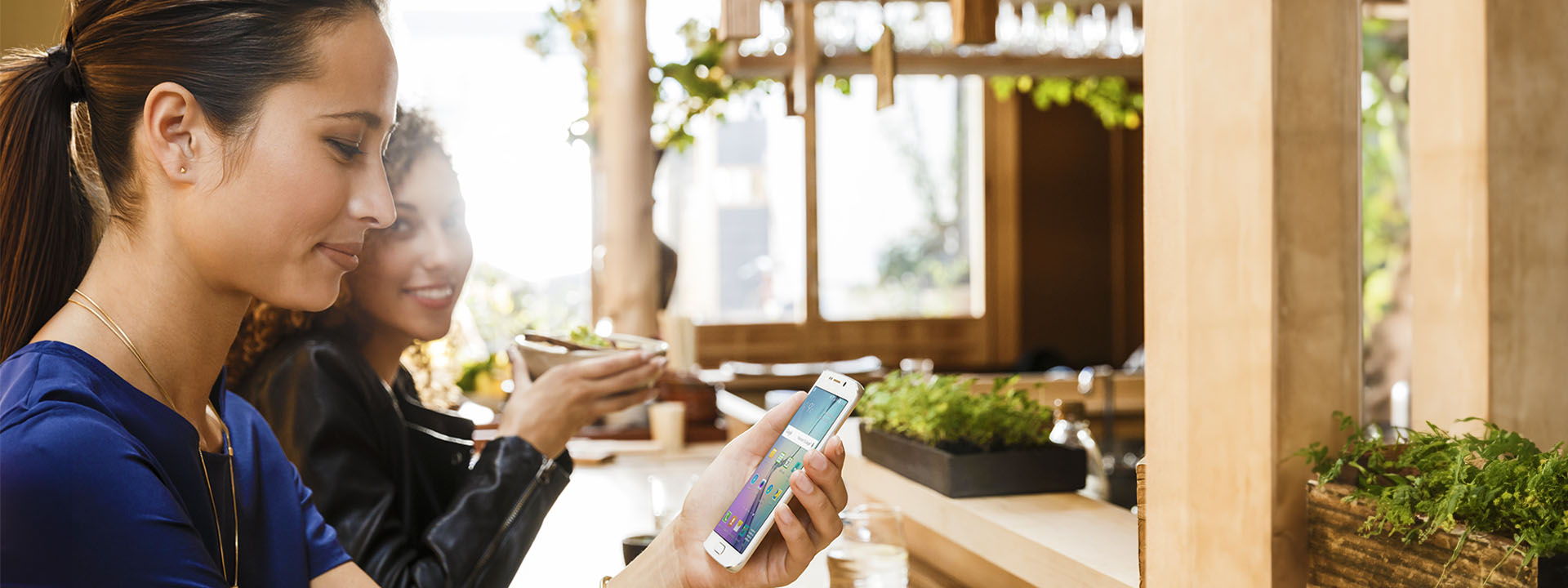 woman on phone in cafe